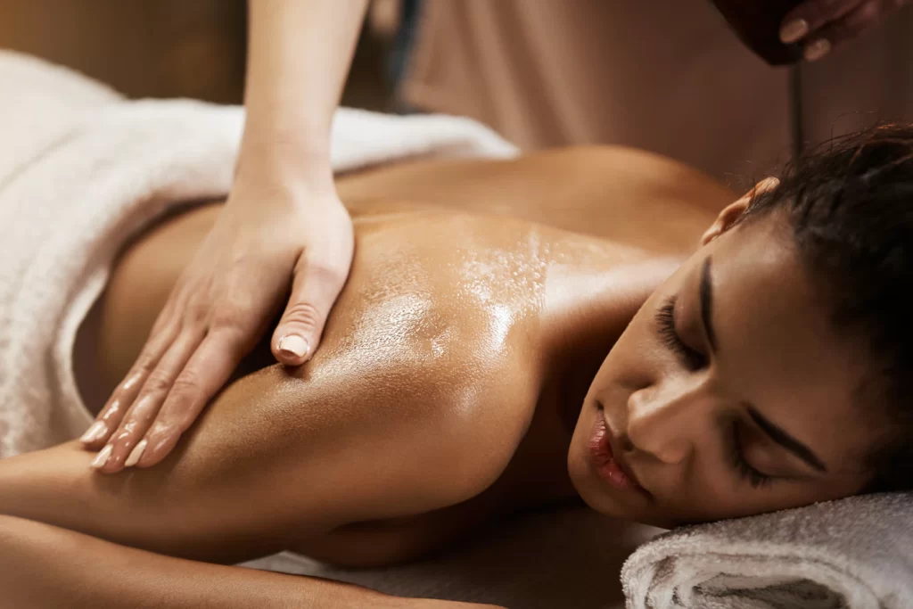 Woman Enjoying Body Massage Treatment