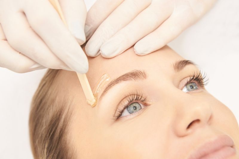 Woman Getting Eyebrow waxing