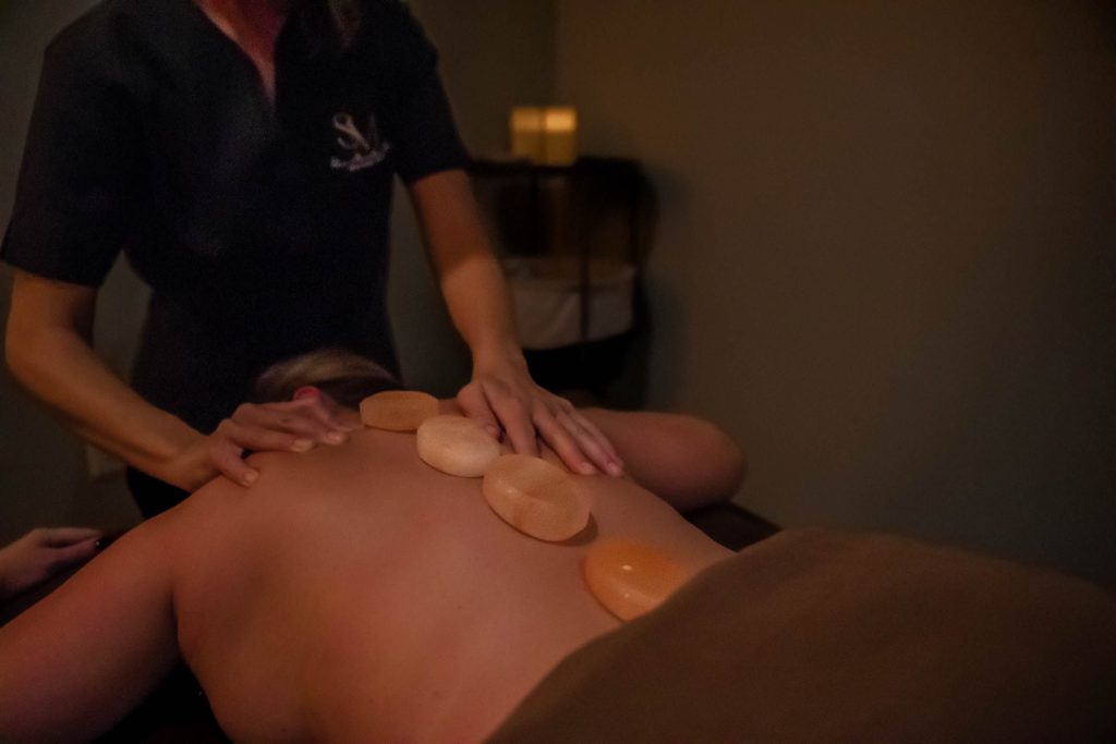 a woman getting Salt Stone Massage